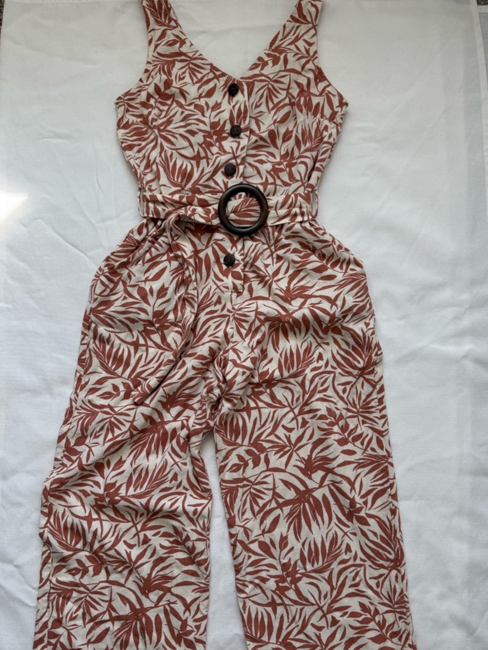 Sleeveless V-Neck Belted Jumpsuit in Rust Leaf Print